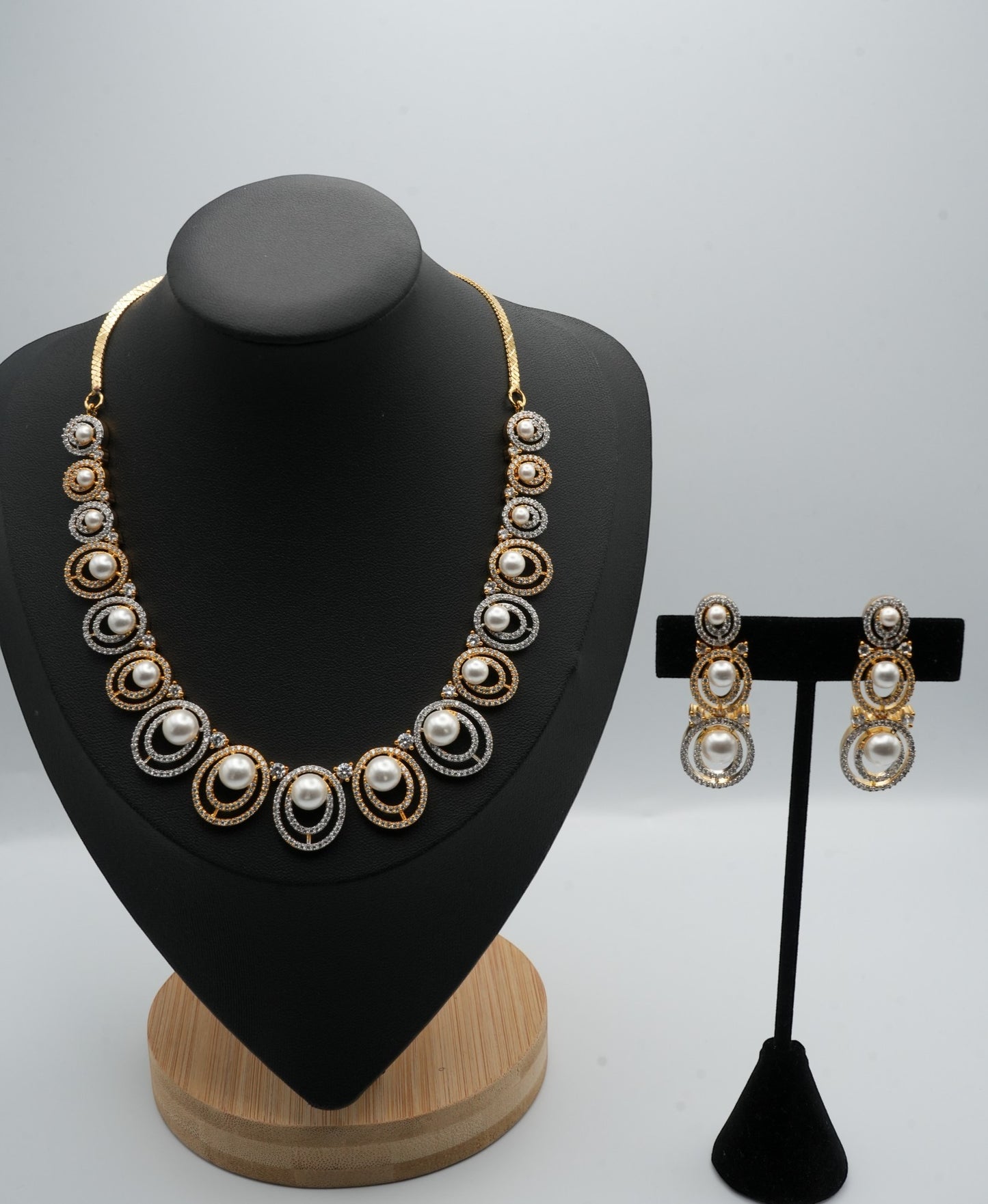 Opulent Pearl and Crystal Necklace and Earring Set with Dual-Tone Finish