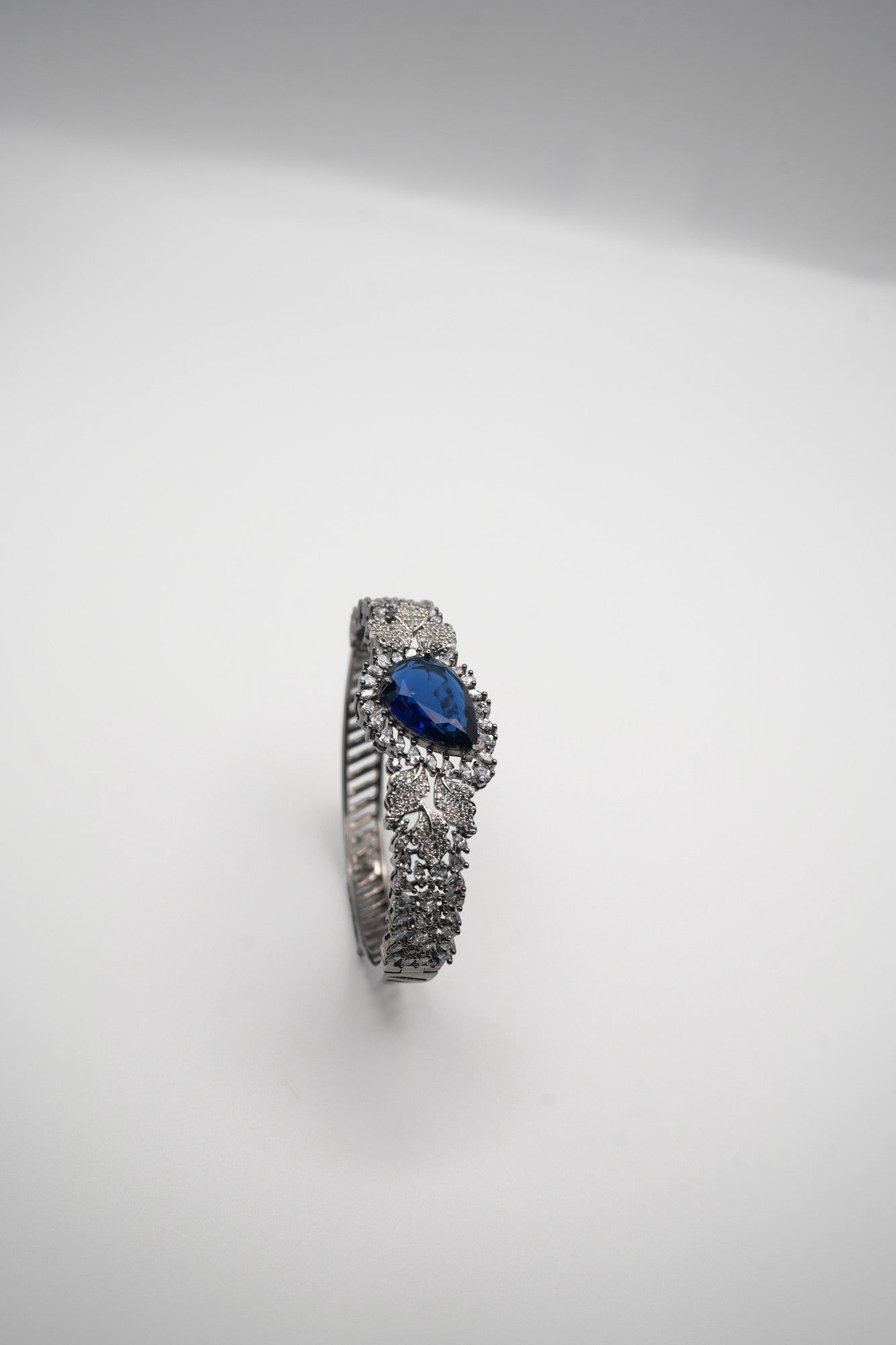 Sapphire Sparkle: Zircon-Accented Bangle Bracelet