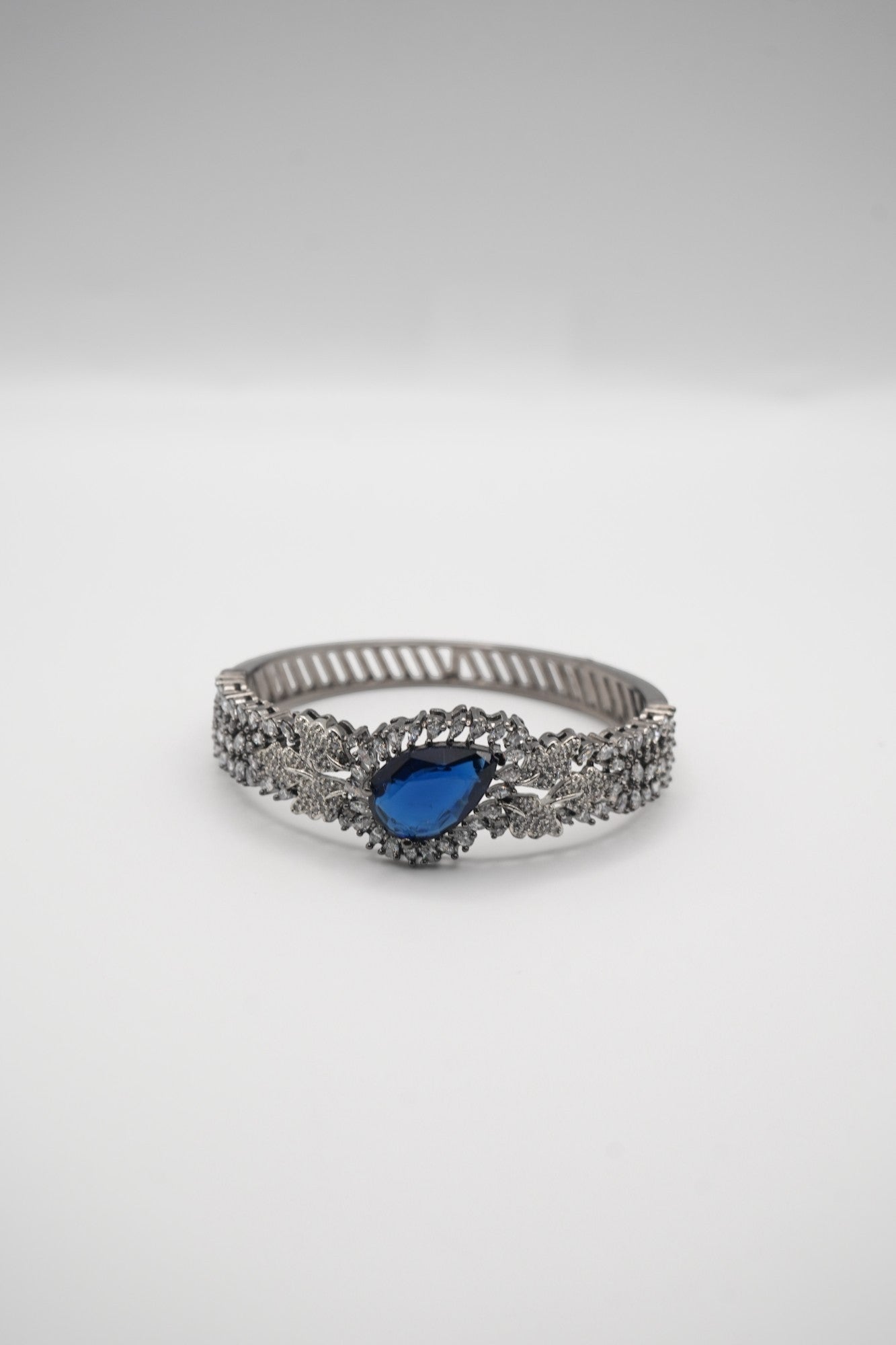 Sapphire Sparkle: Zircon-Accented Bangle Bracelet
