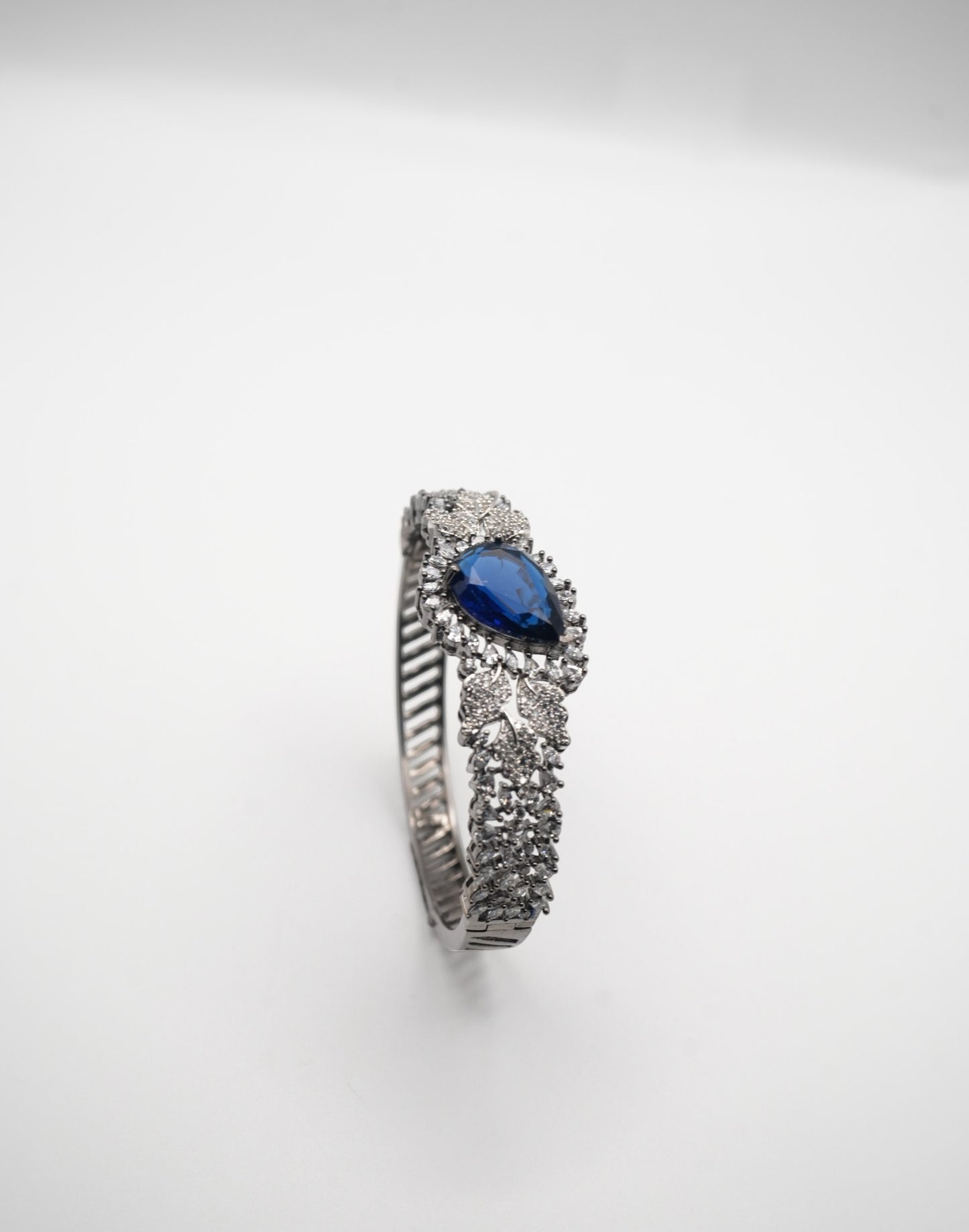 Sapphire Sparkle: Zircon-Accented Bangle Bracelet