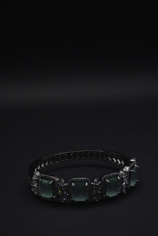 Elegant Silver coated Bangle with Green Rectangular Gemstones and Clear Crystal Accents