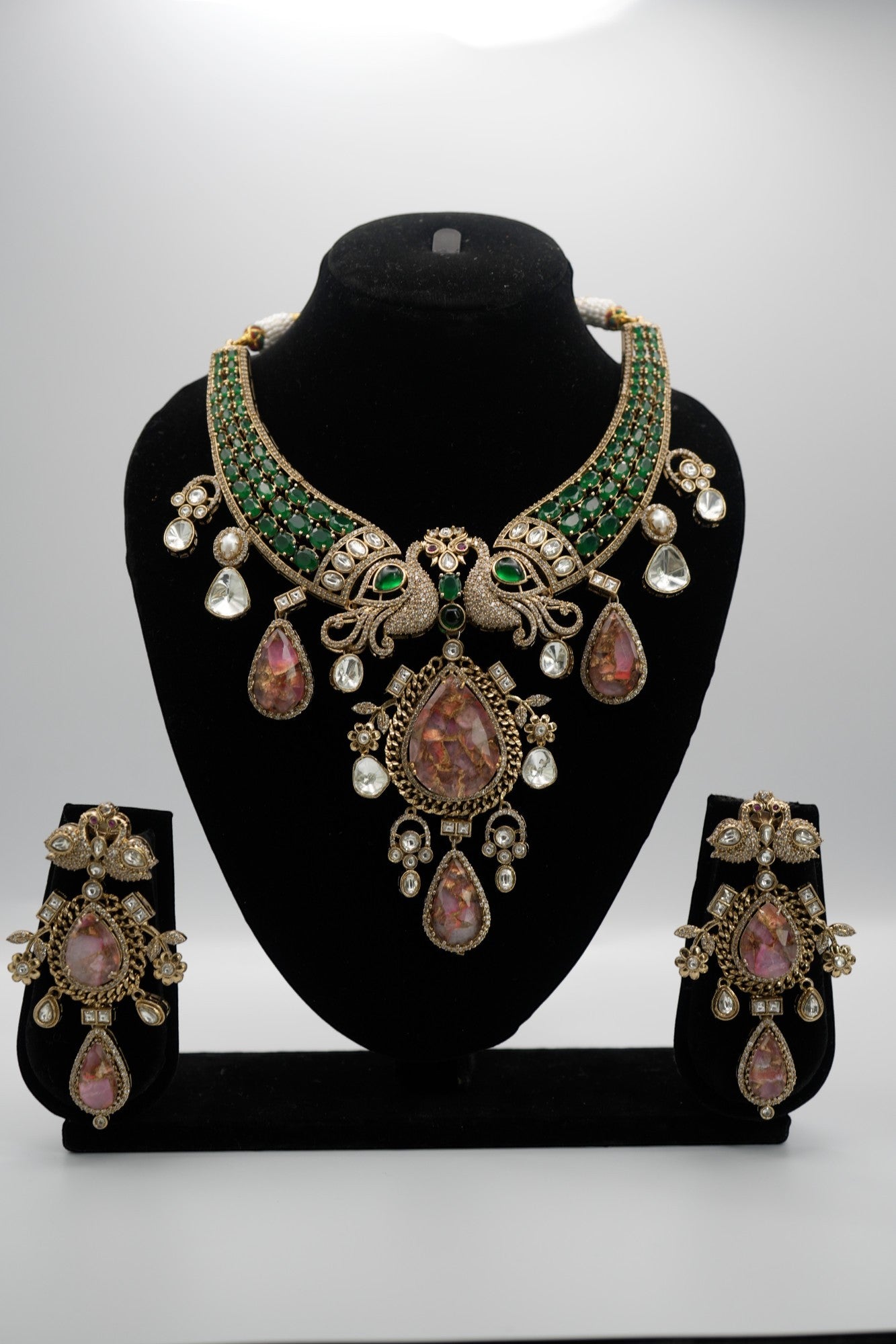 Elevate your elegance with this regal peacock-inspired antique necklace and earring set