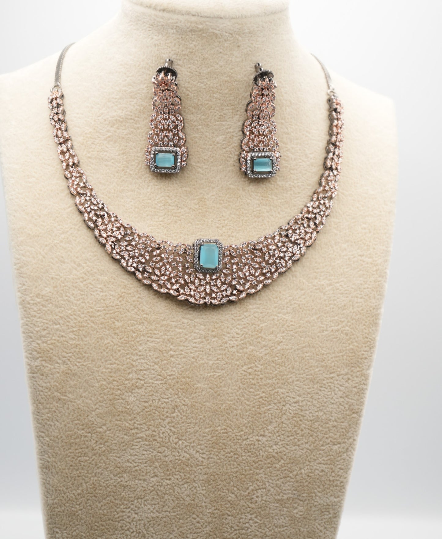 Intricate Silver-Plated Necklace With rose gold combination Set with Aquamarine Accents