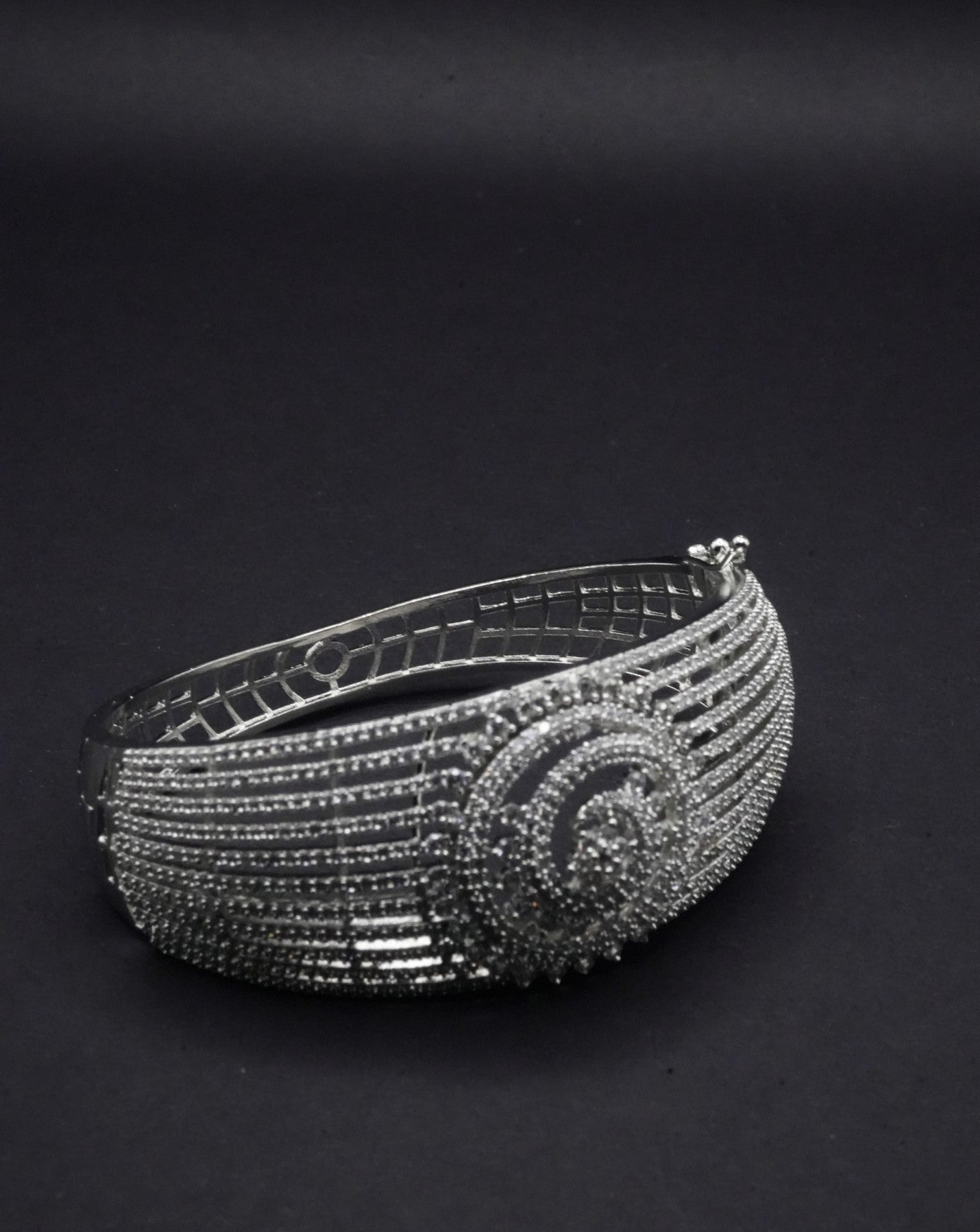 Stunning Silver coated Bangle with Intricate Spiral and Linear Crystal Design