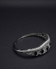 Elegant Silver Coated Bangle with Black Teardrop and Clear Crystal Accents