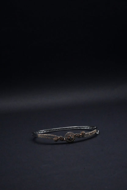 Delicate Silver coated Bangle with Rose Gold Accents and Intricate Knot Design