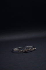 Delicate Silver coated Bangle with Rose Gold Accents and Intricate Knot Design