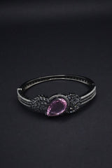 Stunning  Bangle with Purple Teardrop Gemstone and Leaf Motif Detailing