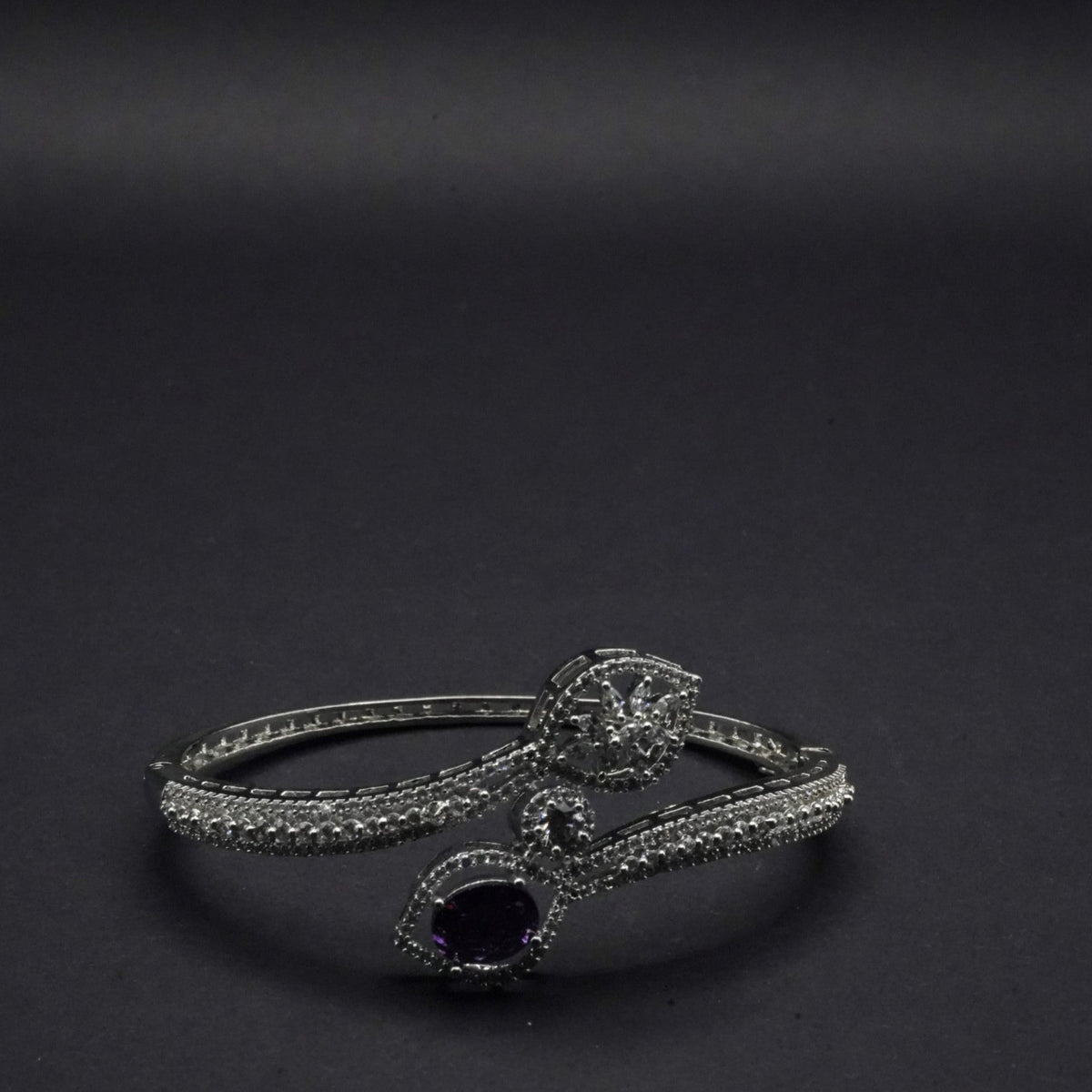 Sophisticated Silver coated Bangle with Dual Stone Accents and CZ Stones like Detailing