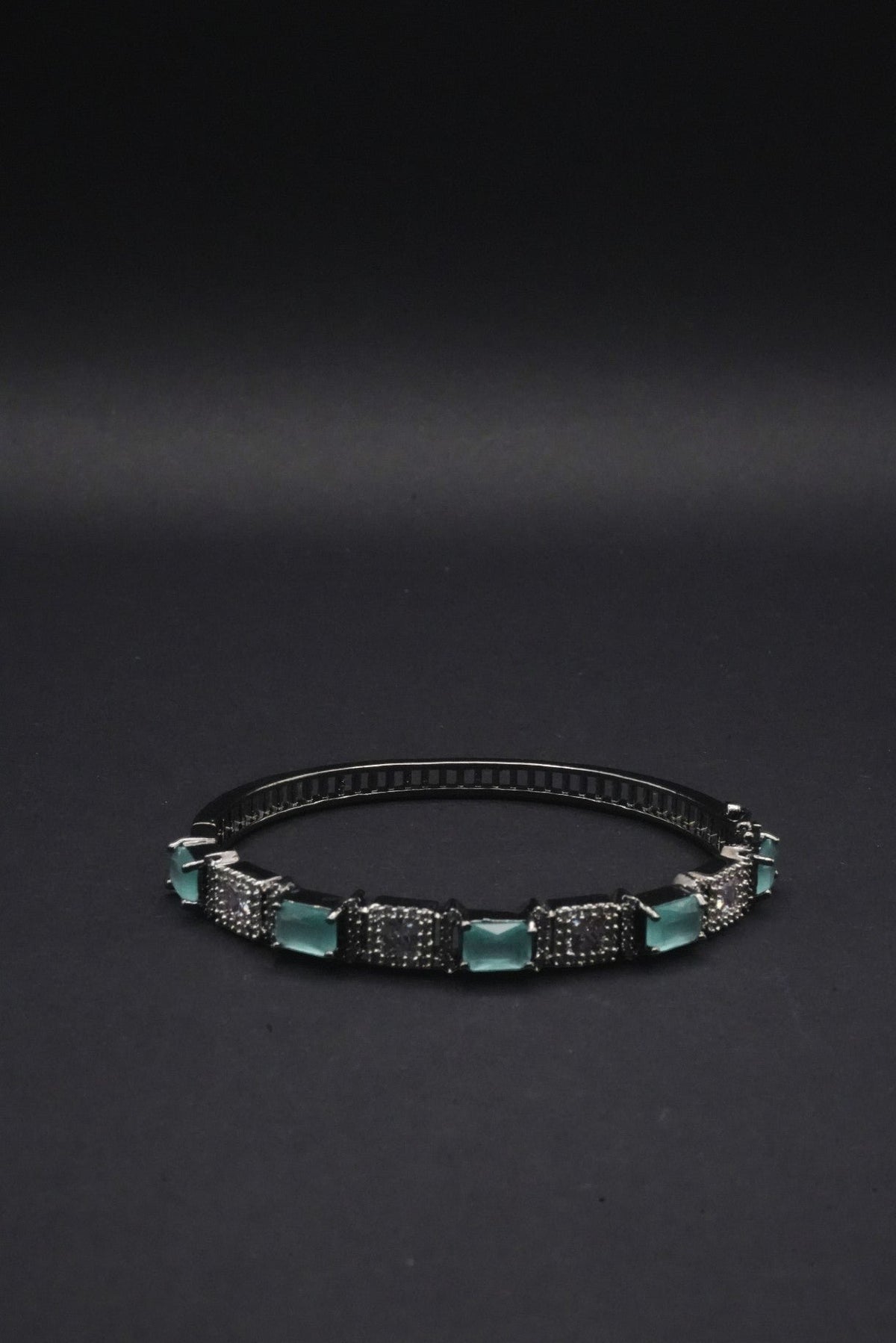 Sleek Black Bangle with Aqua Blue stones and Pavé Crystal Detailing