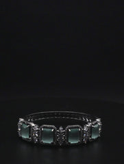 Elegant Silver coated Bangle with Green Rectangular Gemstones and Clear Crystal Accents