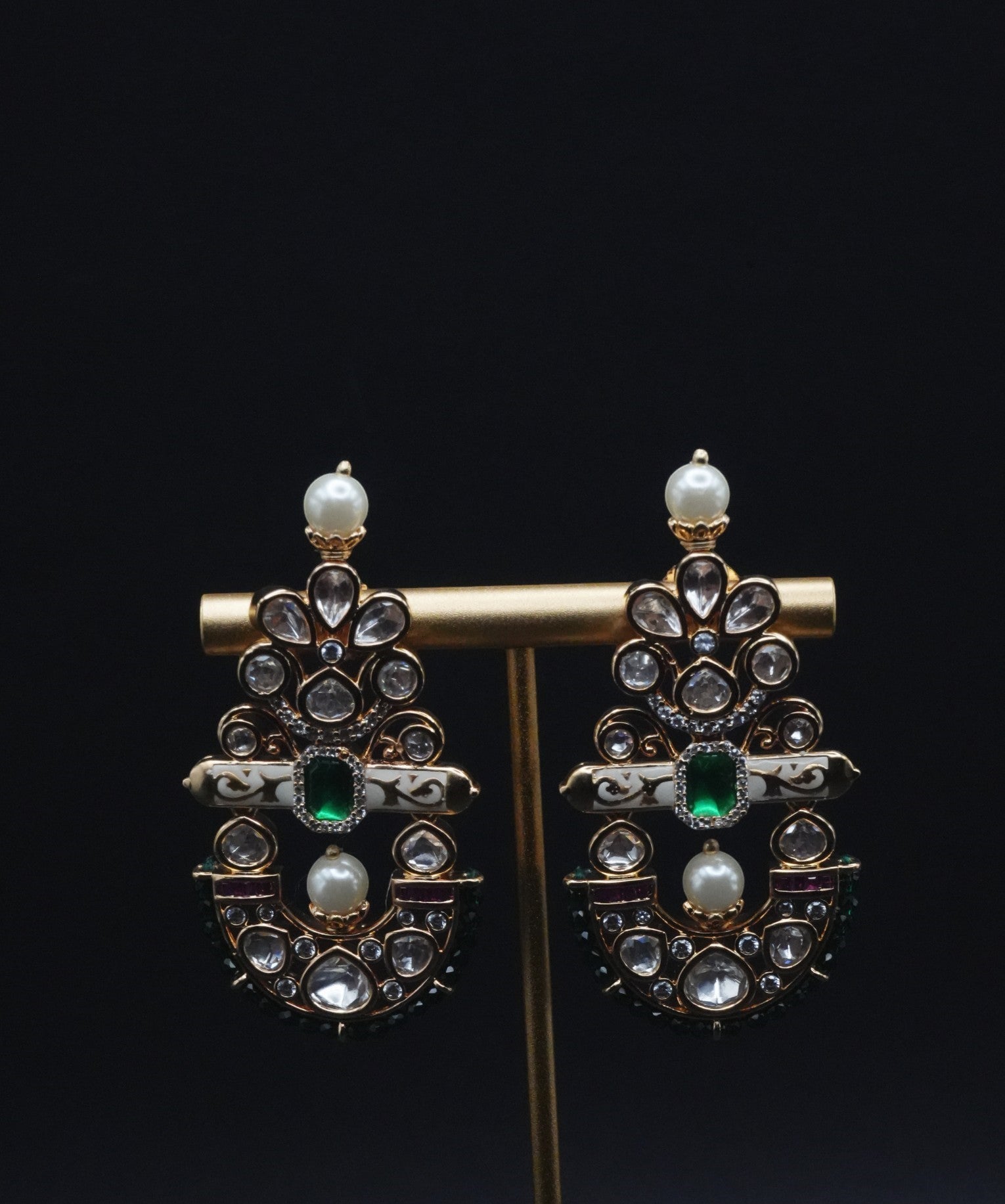 Beautiful Earrings paired with pearls and Clear stones including Green Stone