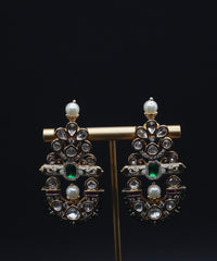 Beautiful Earrings paired with pearls and Clear stones including Green Stone