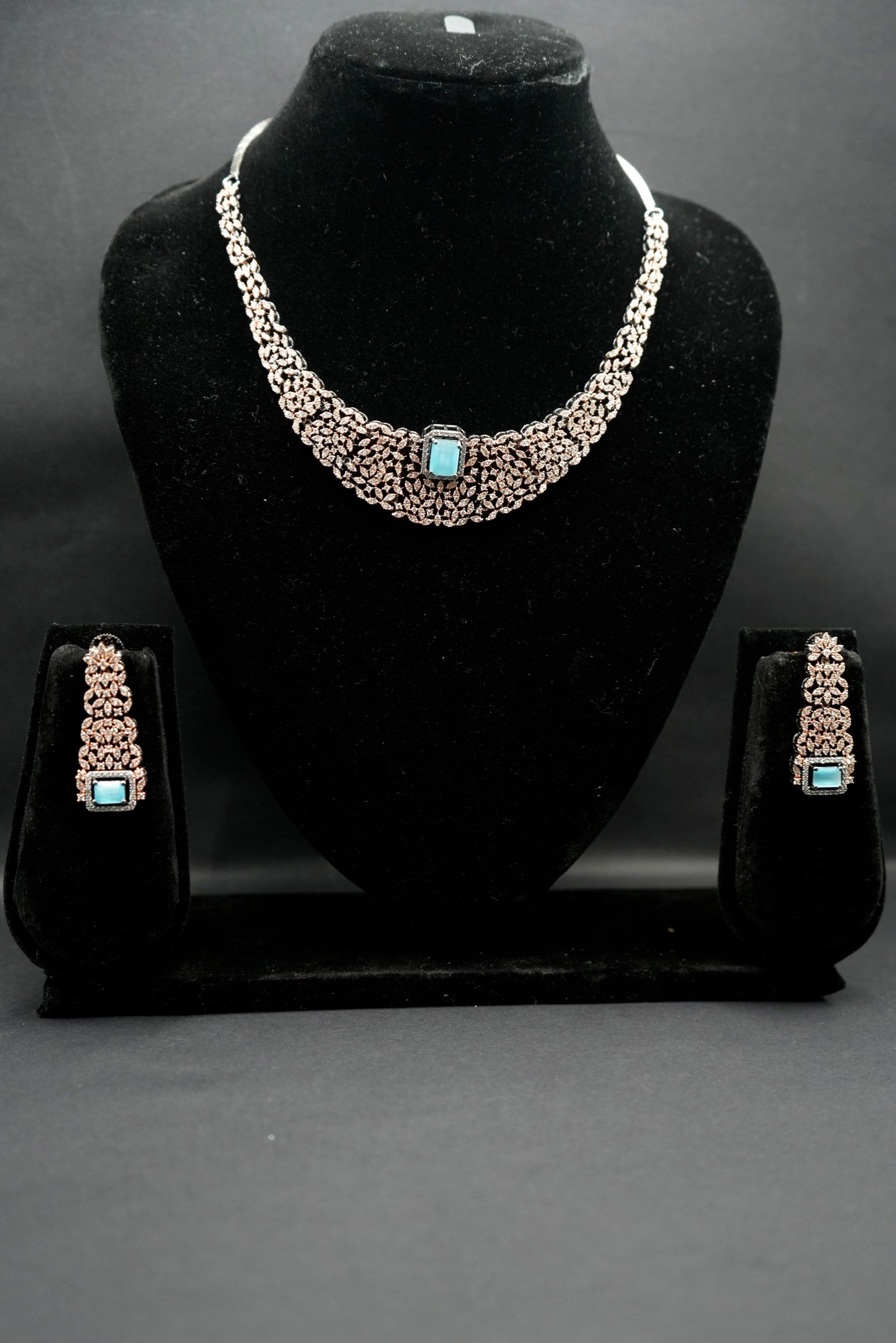 Intricate Silver-Plated Necklace With rose gold combination Set with Aquamarine Accents