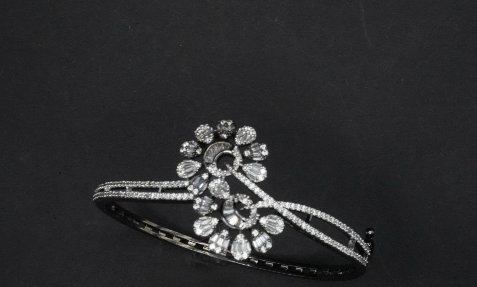 Elegant Silver coated Bangle with Intricate Crystal Floral Motif