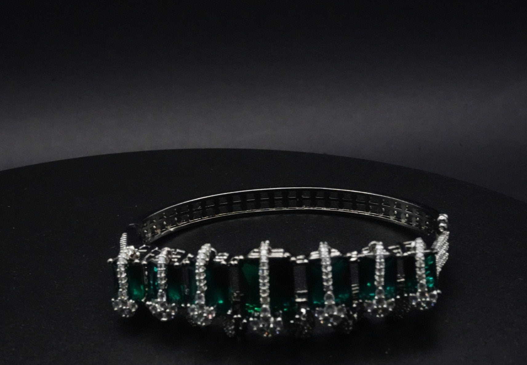 Luxurious Silver coated Bangle with Emerald Green Gemstones with CZ Crystals