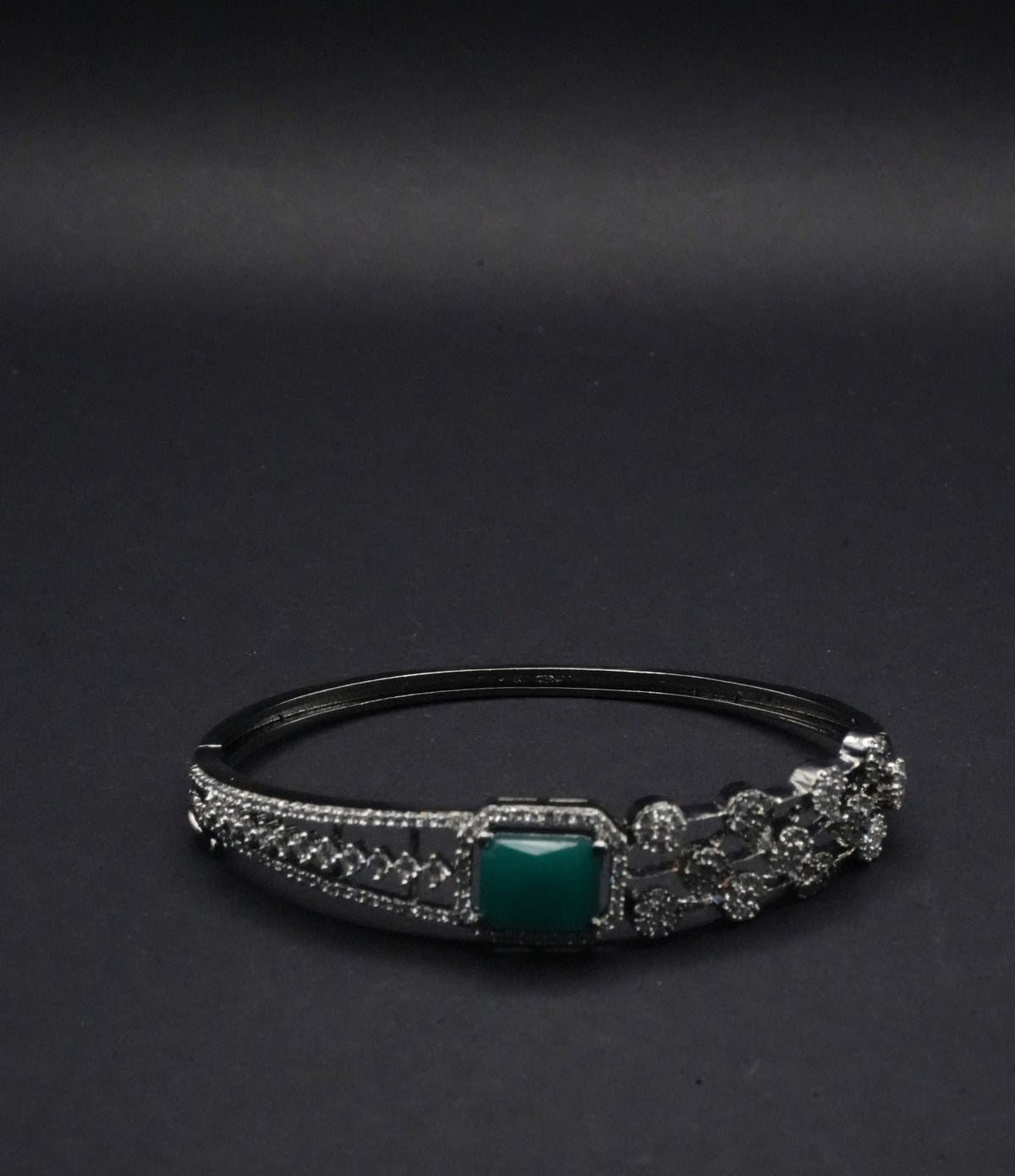 Elegant Silver coated Bangle with Green Stone and CZ Stones Detailing