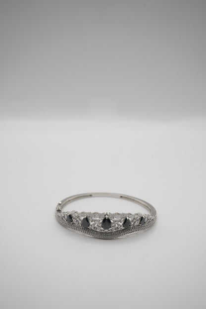 Elegant Silver Coated Bangle with Black Teardrop and Clear Crystal Accents