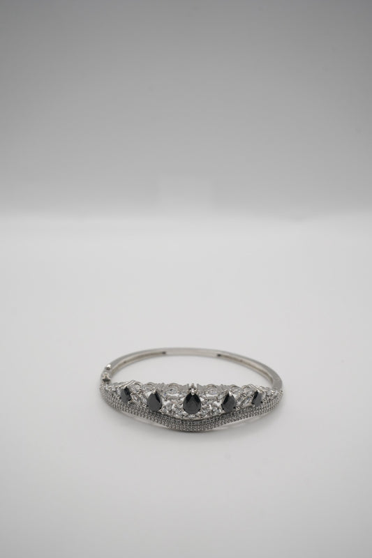 Elegant Silver Coated Bangle with Black Teardrop and Clear Crystal Accents