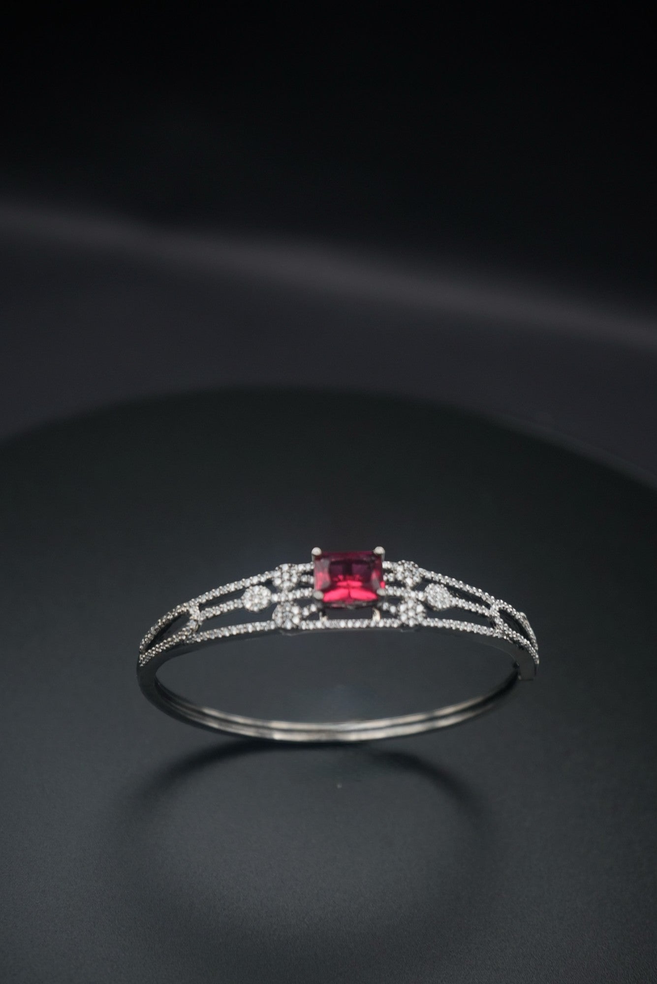 Ruby Radiance: Zircon and Crystal Bangle Bracelet