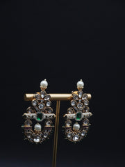 Beautiful Earrings paired with pearls and Clear stones including Green Stone