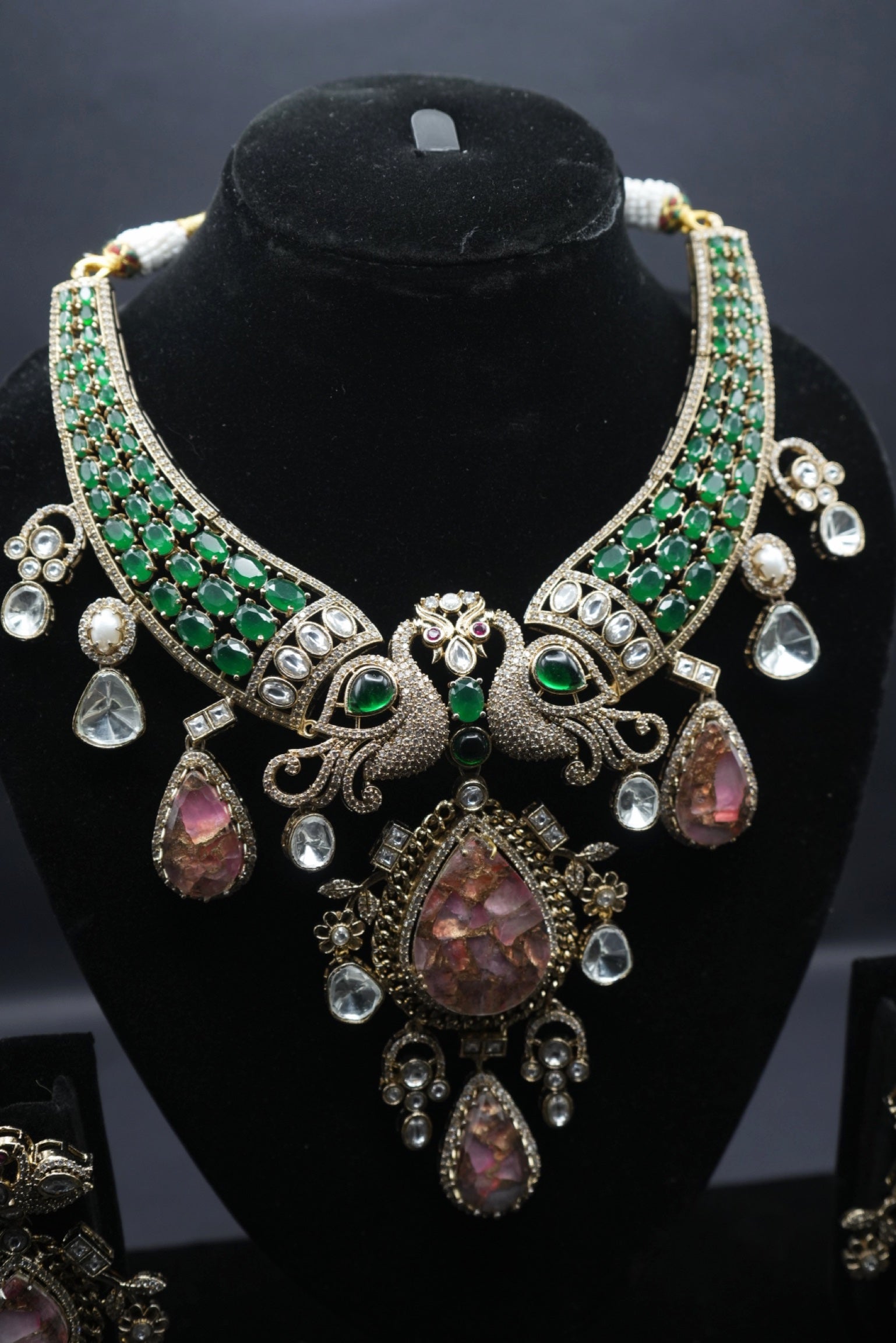 Elevate your elegance with this regal peacock-inspired antique necklace and earring set