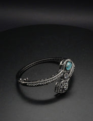 Elegant Silver coated Bangle with Aqua Blue Gemstone and Pavé Crystal Accents