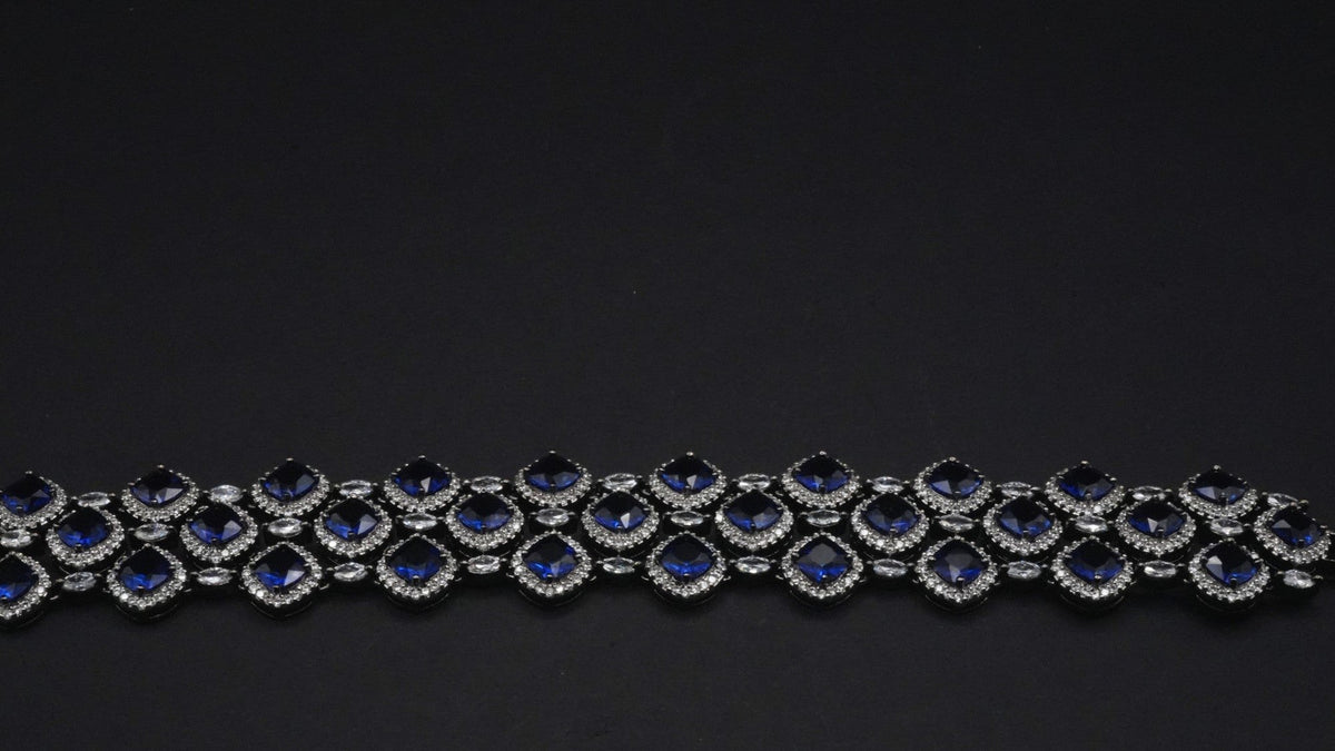 Luxurious Silver coated Bracelet with Deep Blue and Clear Crystal Accents