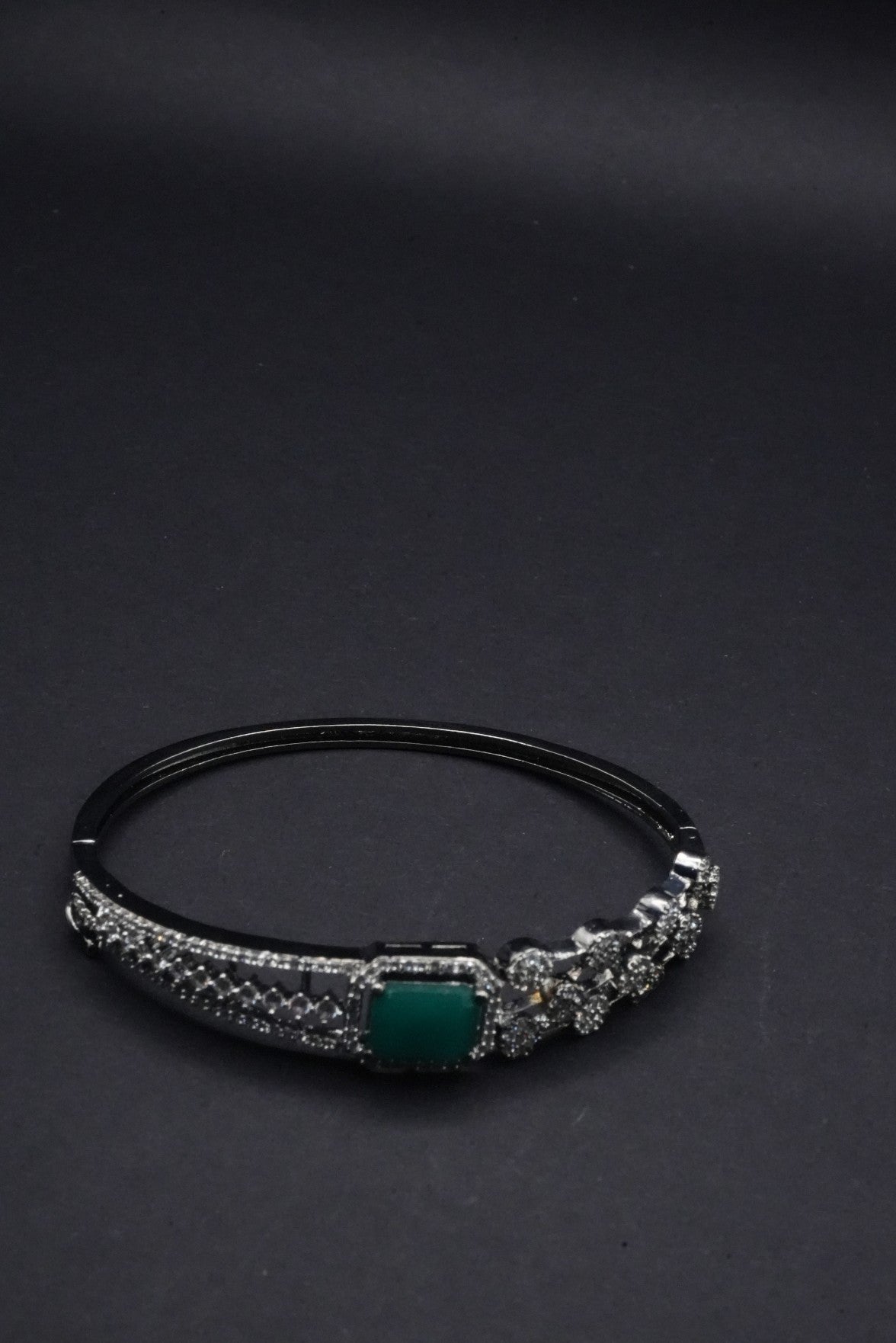 Elegant Silver coated Bangle with Green Stone and CZ Stones Detailing