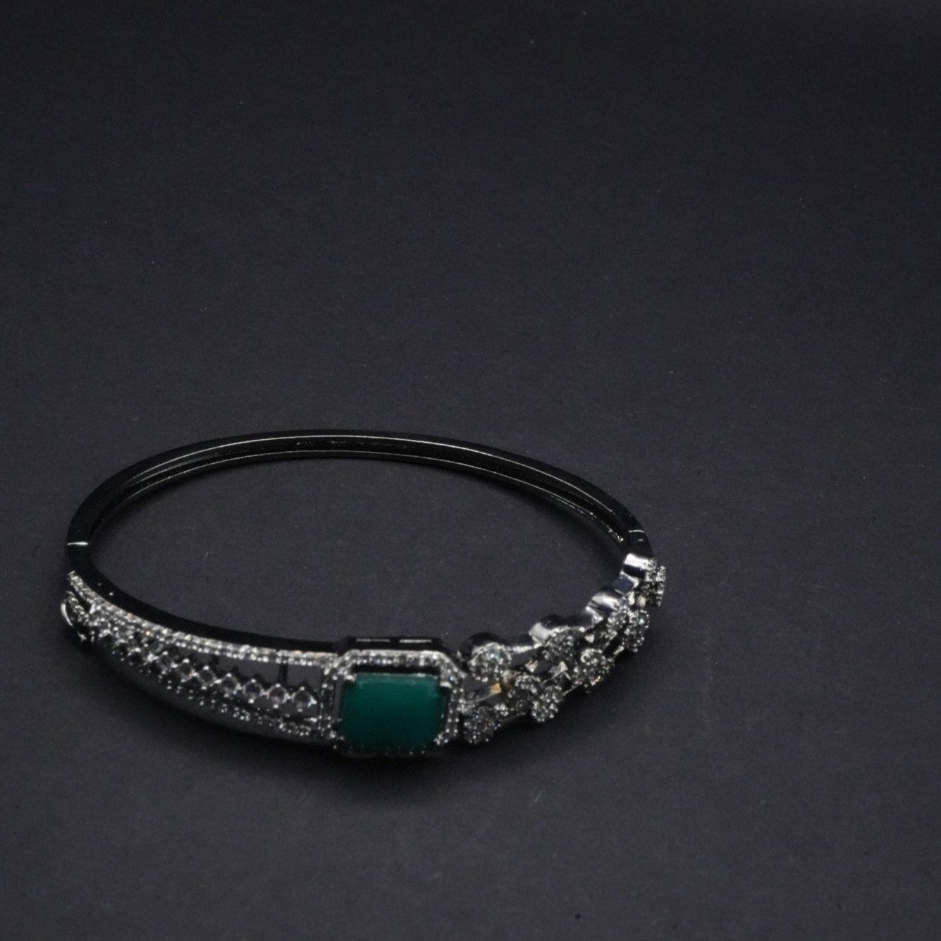 Elegant Silver coated Bangle with Green Stone and CZ Stones Detailing