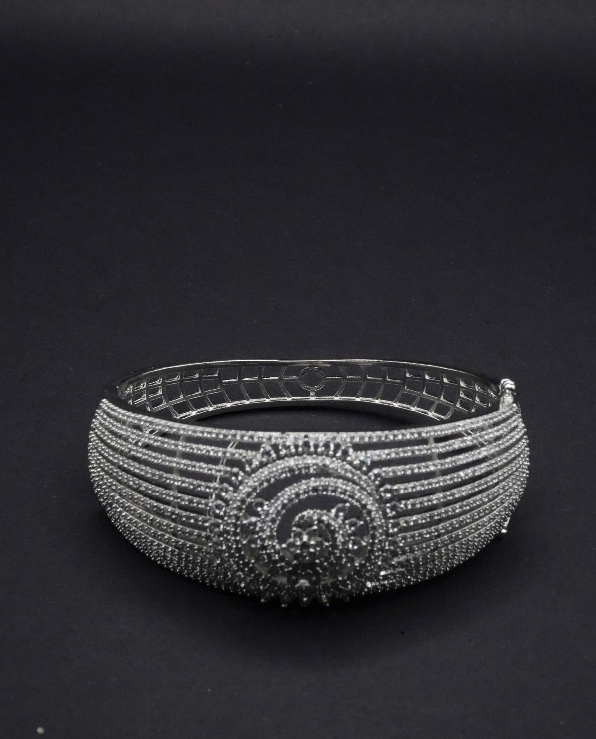 Stunning Silver coated Bangle with Intricate Spiral and Linear Crystal Design