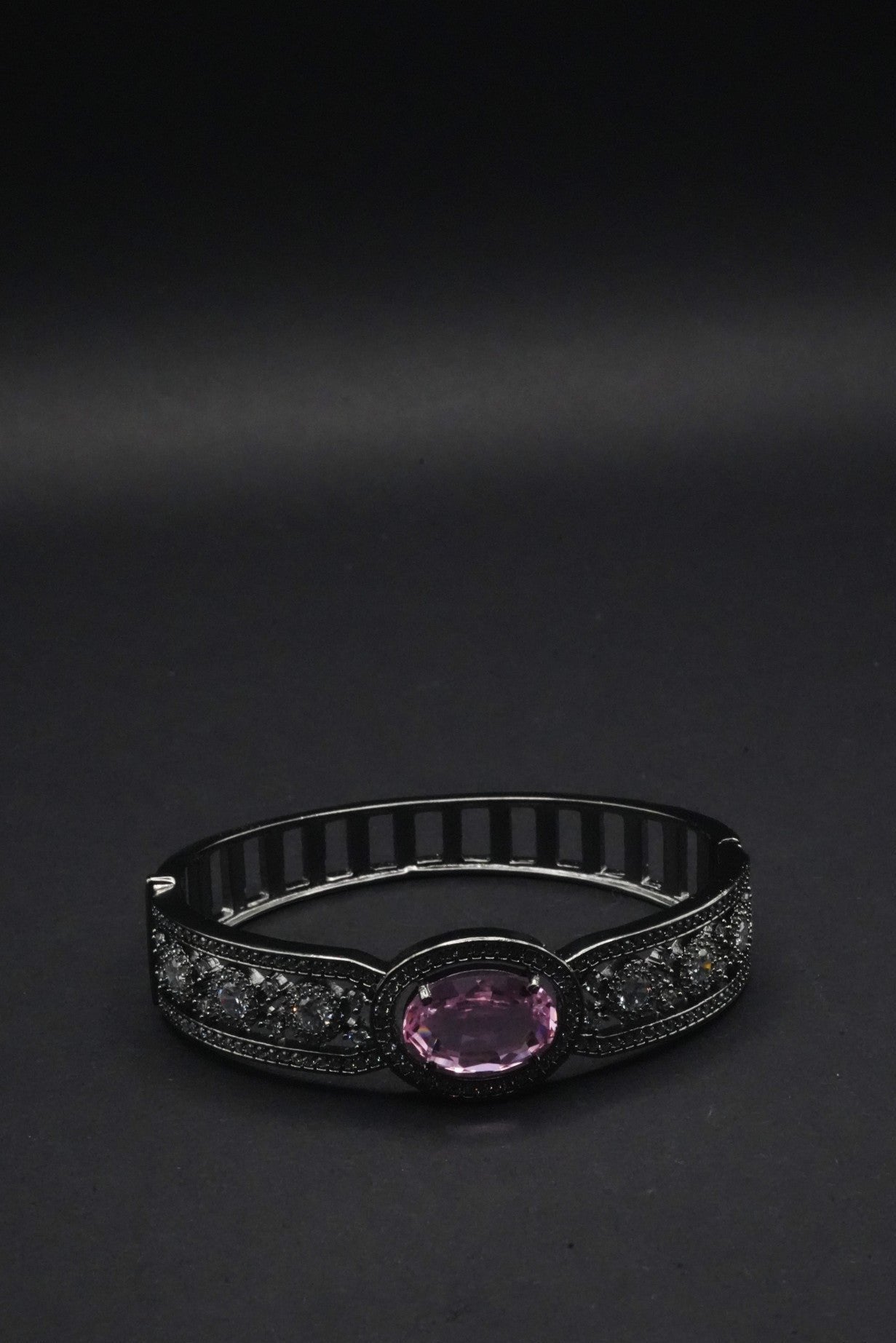 Elegant Black Bangle with Pink Oval Gemstone and Clear Crystal Accents