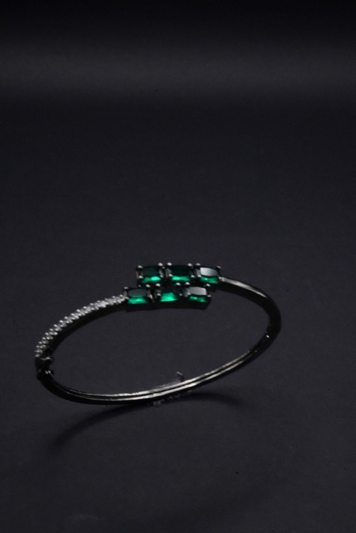 Sleek Silver coated Bangle with Emerald Green stones and Crystal Accents