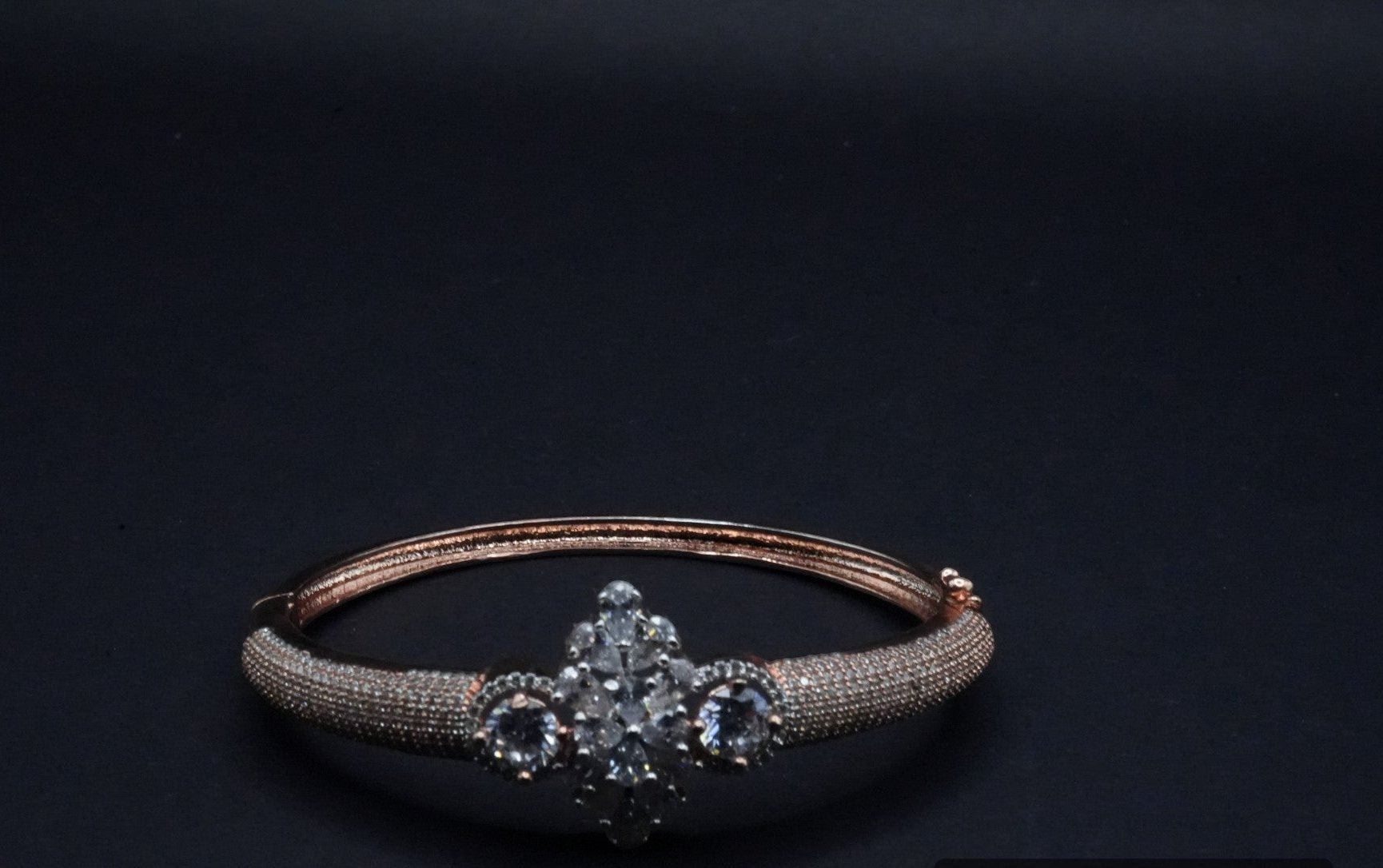 Luxurious Rose Gold Bangle with Central Crystal Cluster and Pavé Detailing