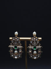 Beautiful Earrings paired with pearls and Clear stones including Green Stone