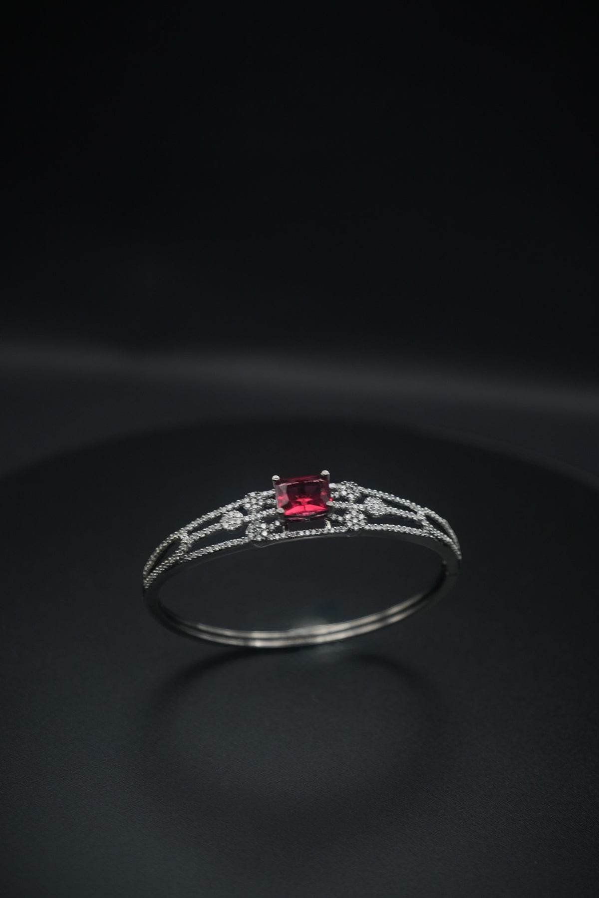 Ruby Radiance: Zircon and Crystal Bangle Bracelet