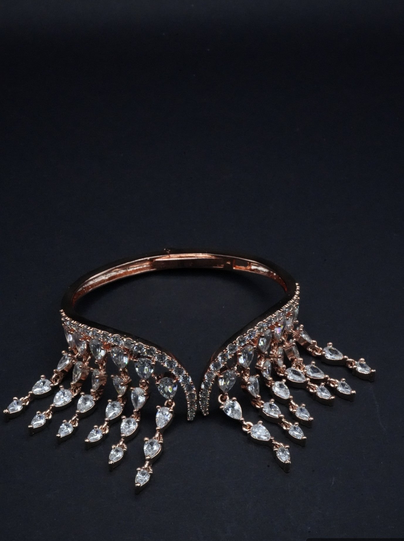 Opulent Rose Gold coated Bangle with Cascading Teardrop Crystal Fringe