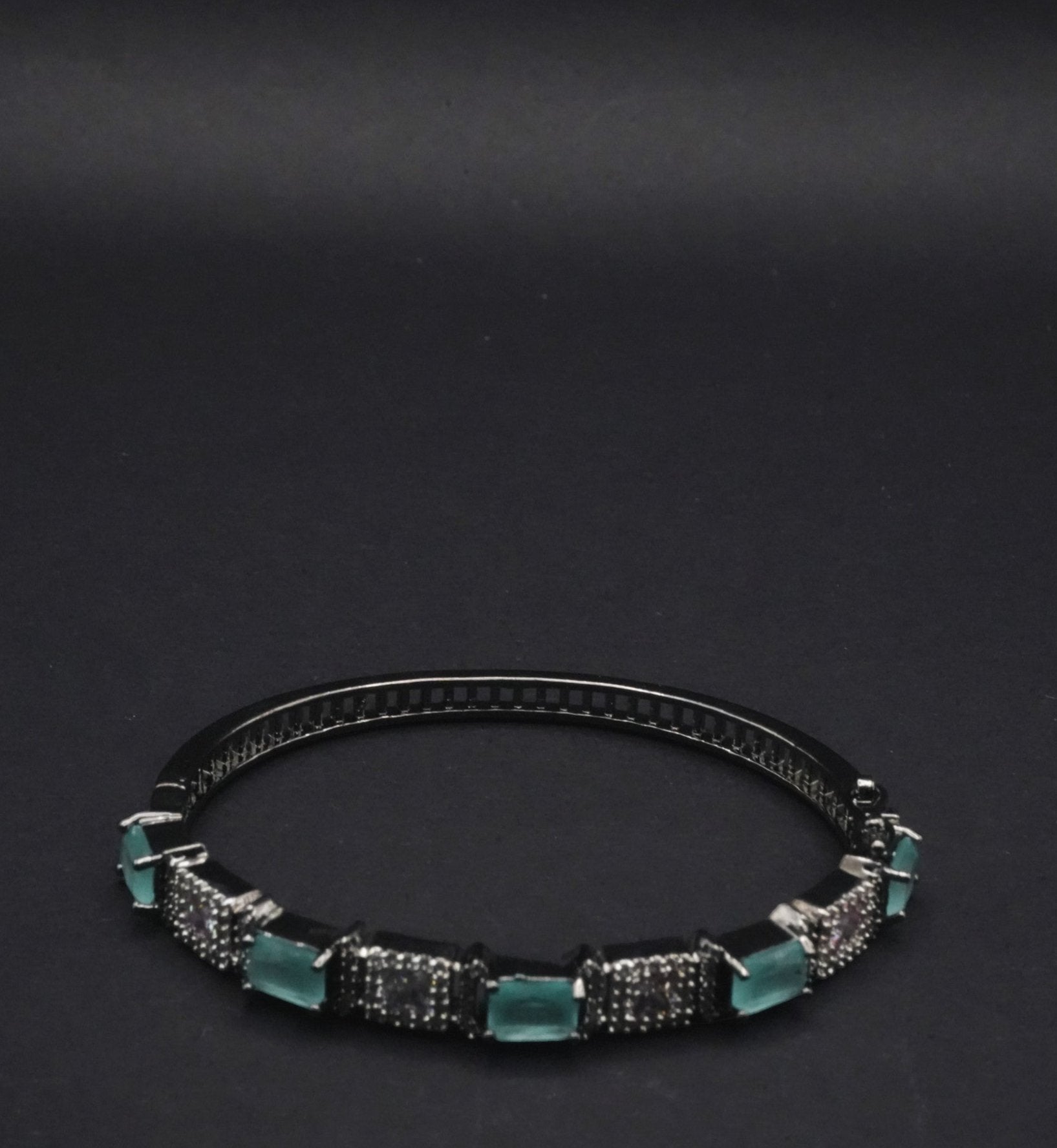 Sleek Black Bangle with Aqua Blue stones and Pavé Crystal Detailing