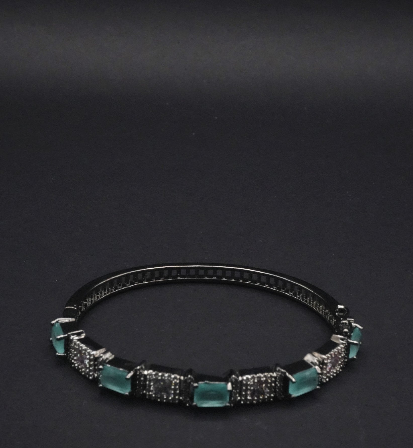 Sleek Black Bangle with Aqua Blue stones and Pavé Crystal Detailing