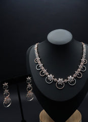 Rose Gold-Tone Necklace and Earring Set with Floral and Circle Motifs