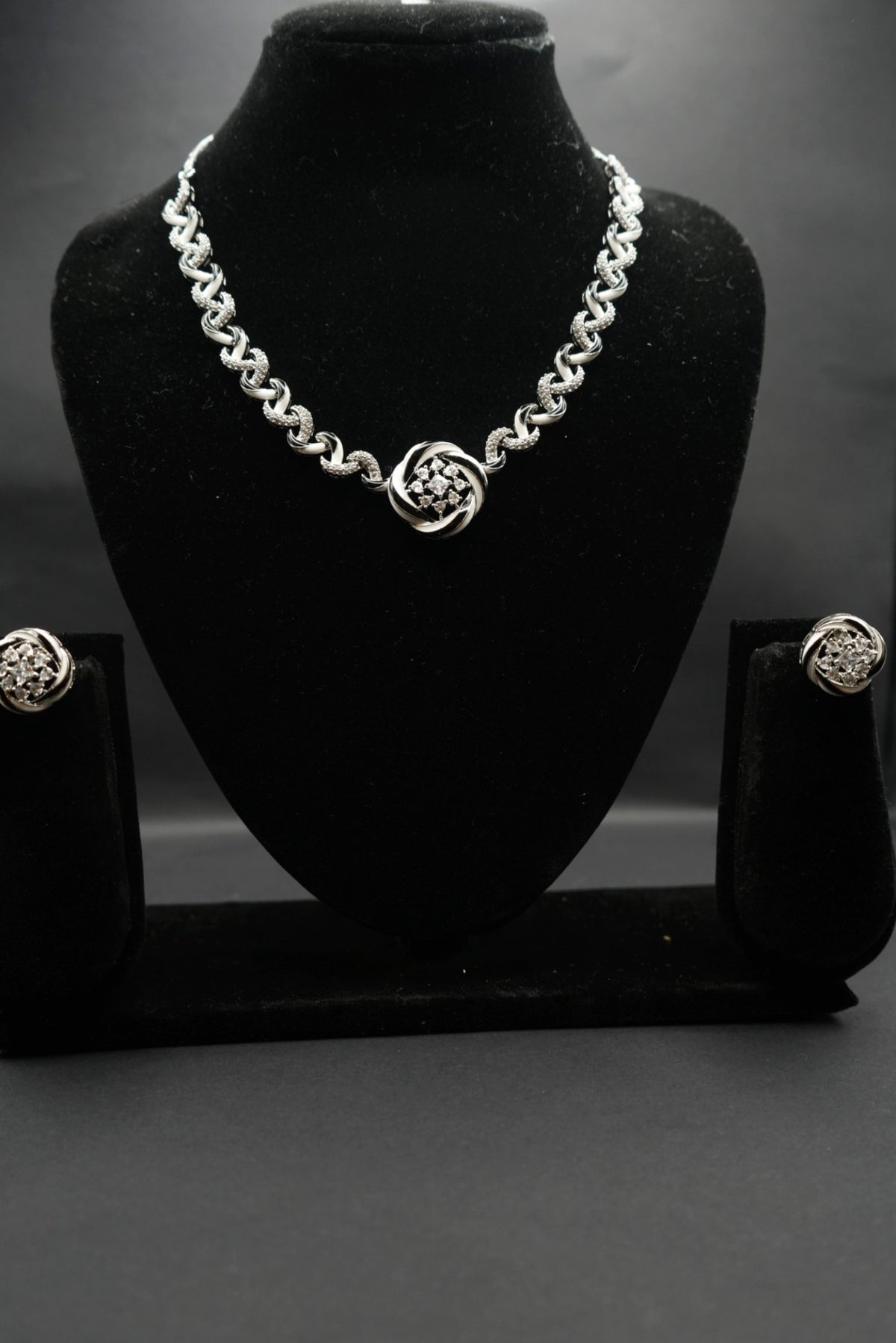 Stylish  necklace with a centerpiece and matching stud earrings