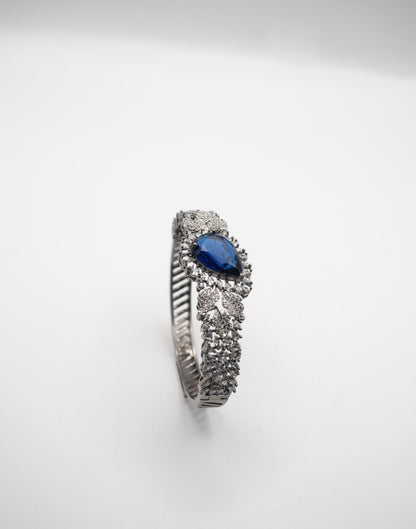 Sapphire Sparkle: Zircon-Accented Bangle Bracelet