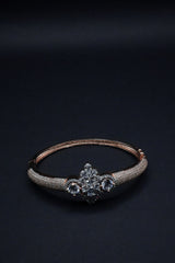 Luxurious Rose Gold Bangle with Central Crystal Cluster and Pavé Detailing