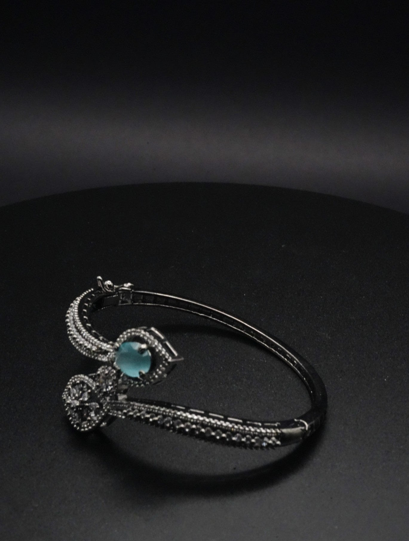 Elegant Silver coated Bangle with Aqua Blue Gemstone and Pavé Crystal Accents