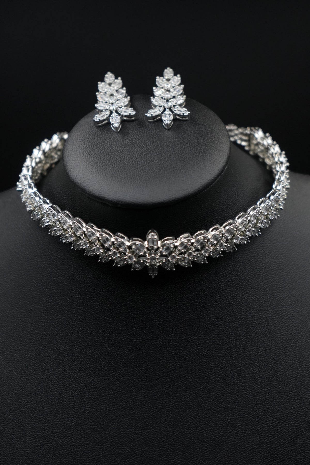 Elevate your elegance with this dazzling CZ necklace and earring set