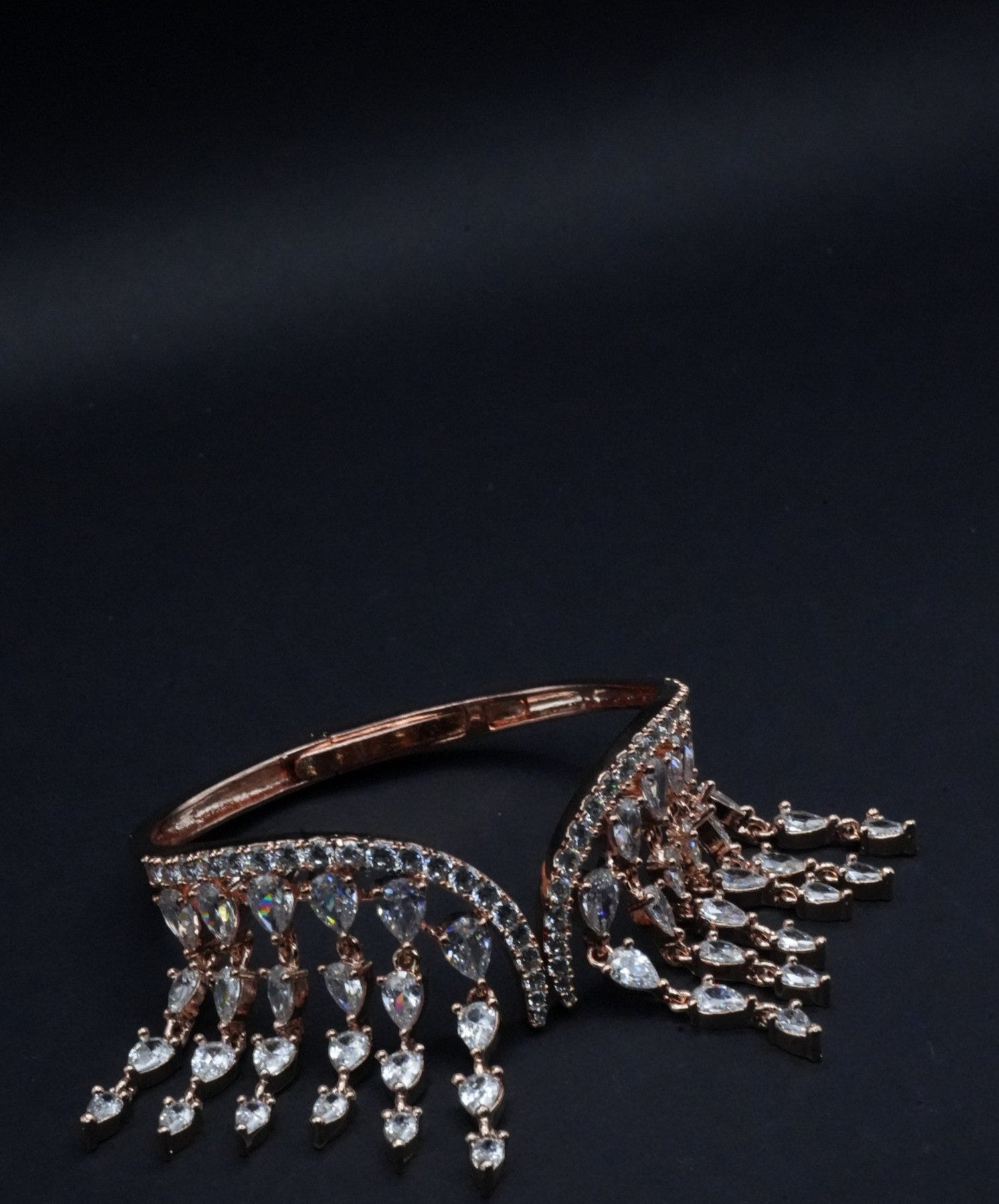 Opulent Rose Gold coated Bangle with Cascading Teardrop Crystal Fringe