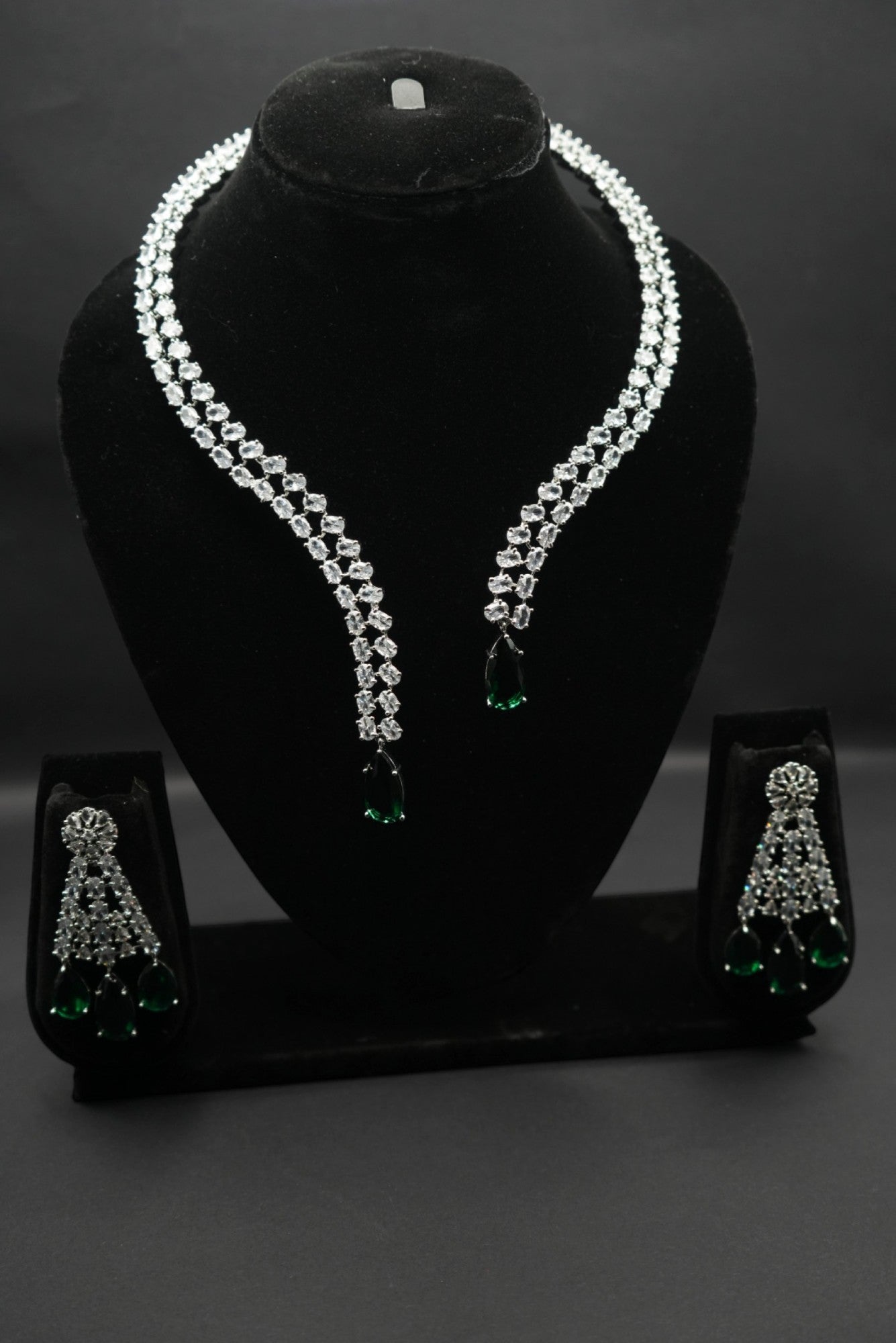 Elegant emerald and crystal necklace and earring set.