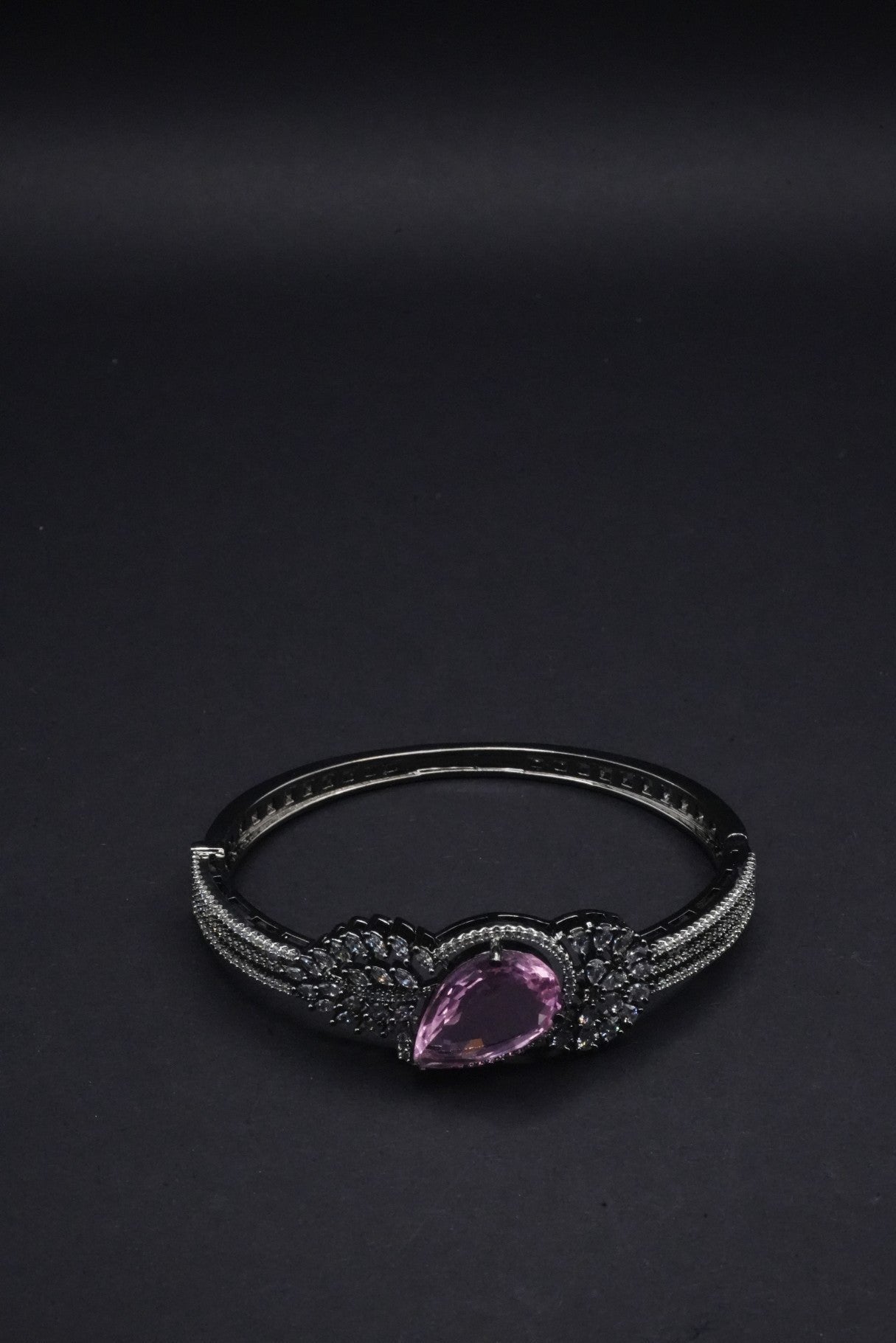 Stunning  Bangle with Purple Teardrop Gemstone and Leaf Motif Detailing