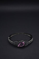 Stunning  Bangle with Purple Teardrop Gemstone and Leaf Motif Detailing