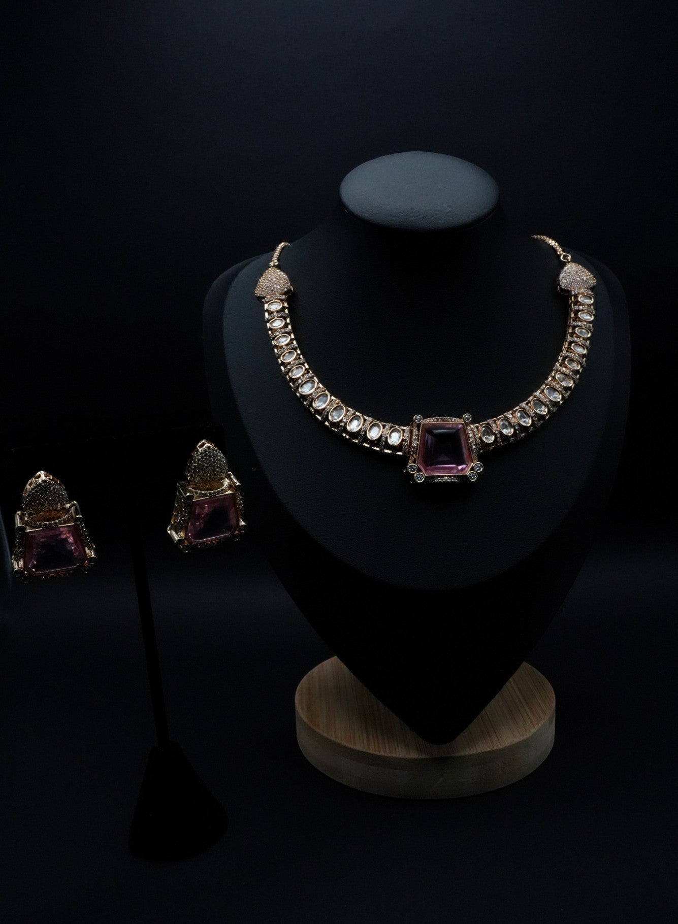 Elegant gold coated Pink Stone with white kundans paired with Earrings